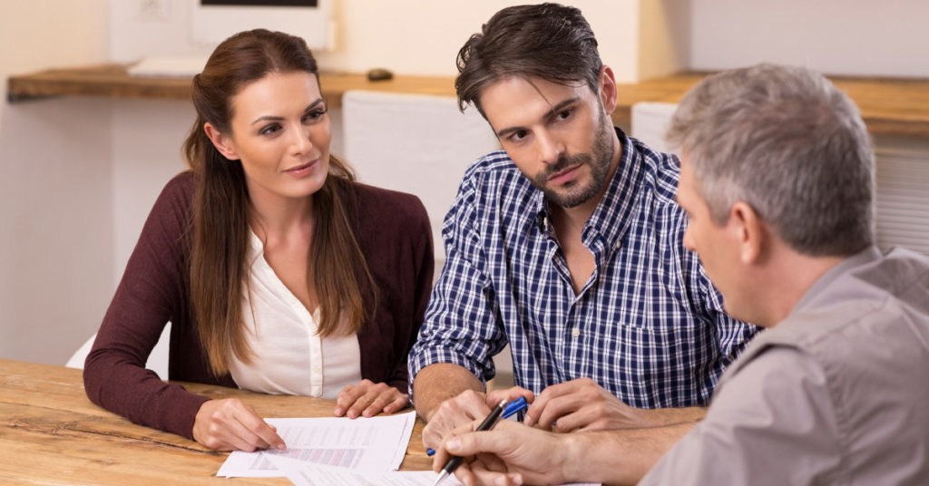 Three people discussing